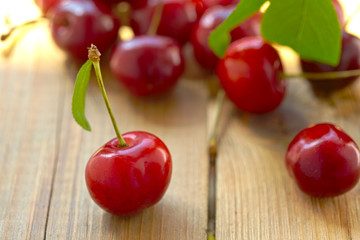 fresh cherries on wooden table