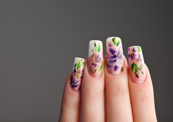 Human fingers with beautiful spring manicure