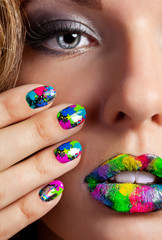 Girl with beautiful multicolor Minx nails and make-up