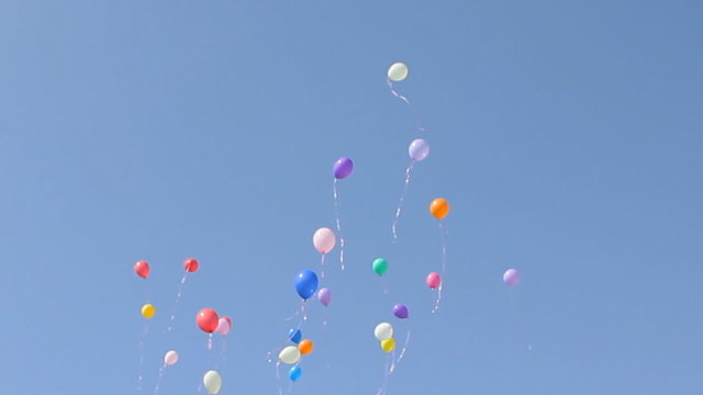 colored balloons fly in the sky. children&rsquo;s Holiday