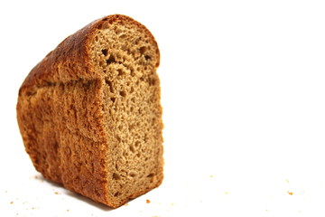 The cut loaf of bread isolated on white