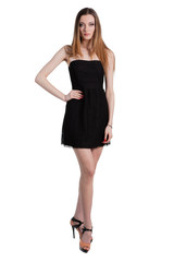 Attractive young woman in a black dress smiling and looking at c