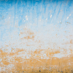 Dilapidated beige and blue wall texture