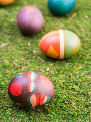 Colorful Easter eggs in grass