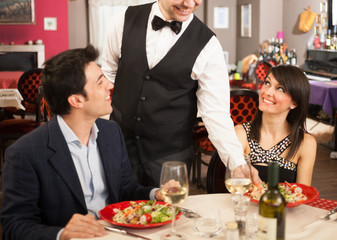 Waiter serving sea food
