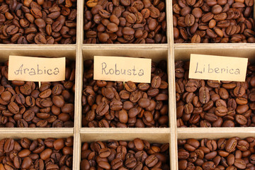 Coffee beans in wooden box close-up
