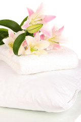 beautiful lily on pillow with towel isolated on white