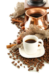 Cup and pot of coffee and coffee beans, isolated on white