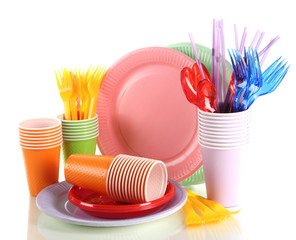 Multicolored plastic tableware isolated on white