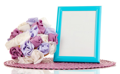 Colorful photo frame and flowers isolated on white