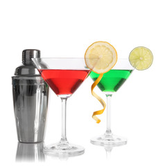 Alcoholic cocktails in martini glasses with shaker isolated