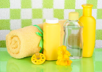 Obraz na płótnie Canvas Baby cosmetics and towel in bathroom