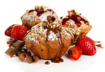 Tasty muffin cakes with strawberries and chocolate, isolated