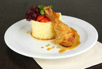 Small portion of food on big plate on wooden table