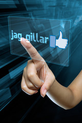 a woman finger select and like  on a swedish digital screen