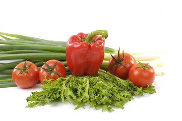 healthy fresh vegetables- paprika and red tomatoes with onion and green lettuce