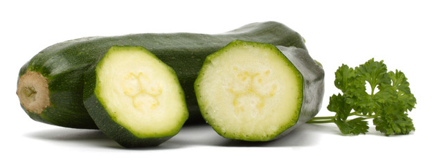 Two fresh vegetable zucchini isolated on white background