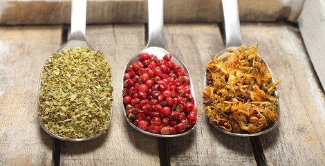 Condiments on wooden background