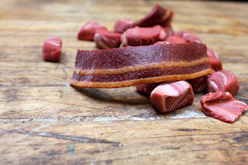 Meat-flavored dog treats on old wood table