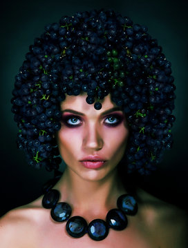 Autumn Woman with Grapes on her Head. Trendy Hairstyle