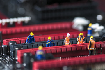 Group of Engineers Fixing Computer Circuit Board