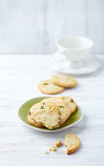 Butter cookies with pistachios on a plate 