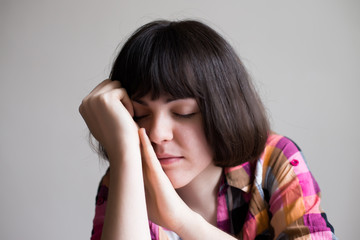 Fototapeta premium businesswoman holding her head in her hands