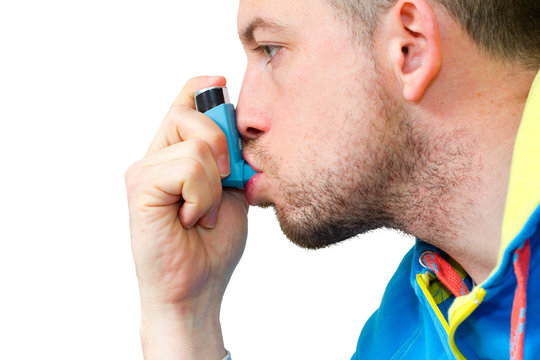 Man Inhaling His Asthma Pump