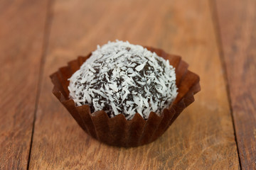 chocolate truffles with coconut on the table
