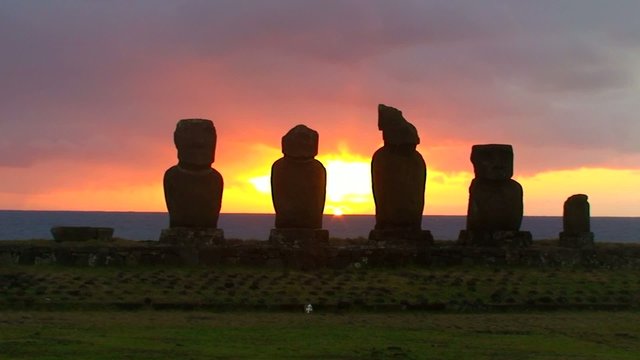 Several moai at Tahai on Easter Island during sunset