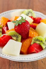 Obraz na płótnie Canvas fruit salad on the white dish