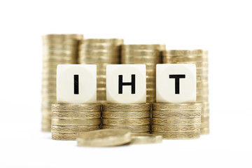 IHT (Inheritance Tax) on gold coins on white background