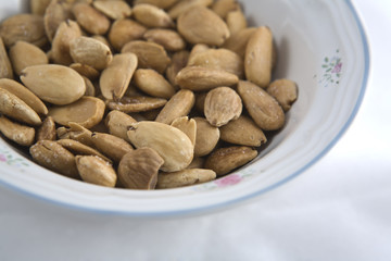 Fried almonds on a bowl, detail