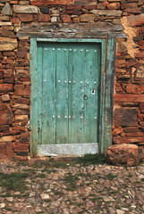 Old door painted in green