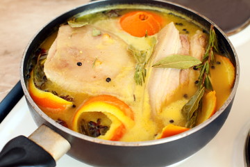 Pork loin in orange juice with spices.