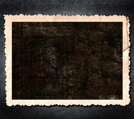 Blank photo frame on the grunge background