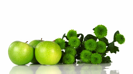 Still life with green apples and green flowers