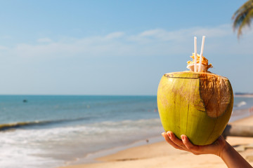 coconut in a female hand