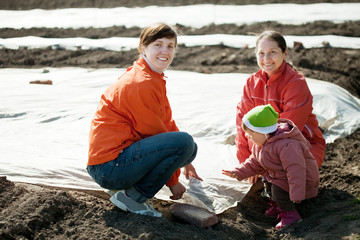 family covers  soil a polyethylene film