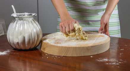 Housewife kneading dough