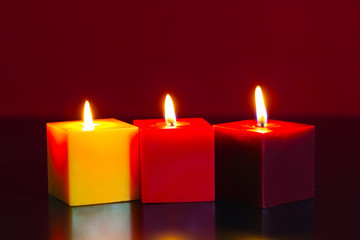 Three burning candles