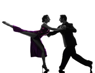 couple man woman ballroom dancers tangoing  silhouette