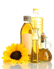 oil in jars and sunflower, isolated on white