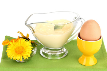 Mayonnaise in bowl on napkin isolated on white