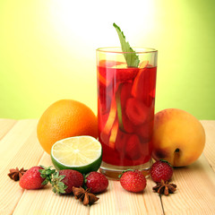 Refreshing sangria in glass with fruits,