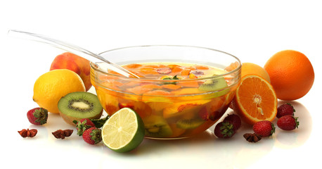 punch in glass bowl with fruits, isolated on white