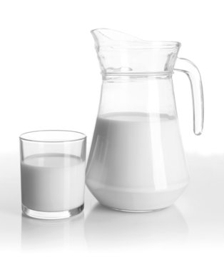 Tasty milk in jug and glass of milk isolated on white