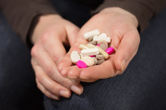 Woman hands with pills