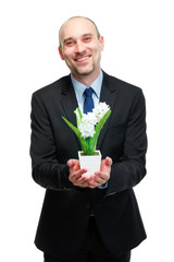 picture of handsome man with flower pot in hand