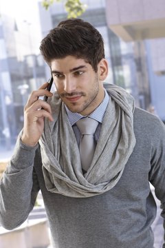 Portrait of confident businessman on phone call